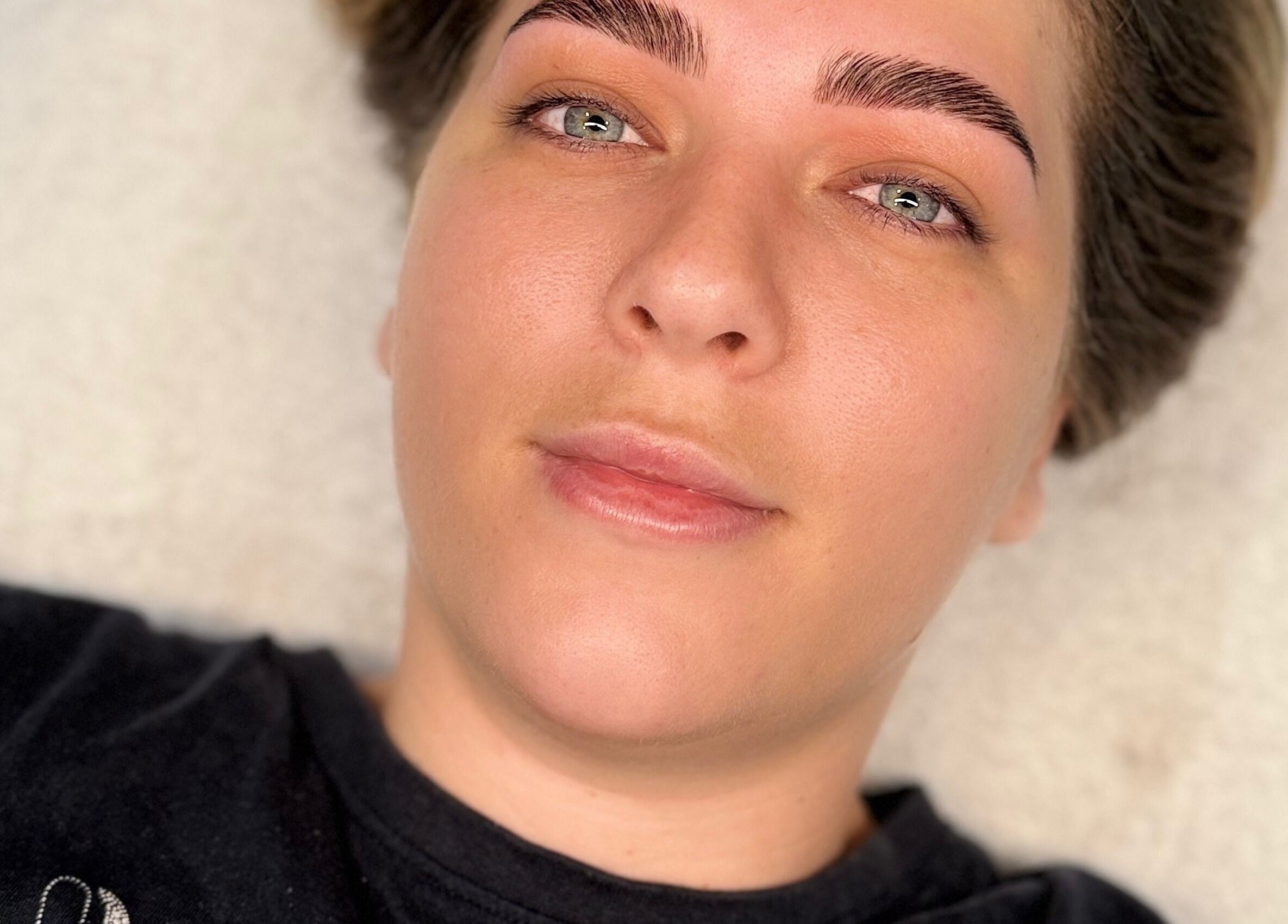 Client enjoying facial at Serene Skin & Body, Mount Hutton, New South Wales, AU. Flawless complexion post-treatment.