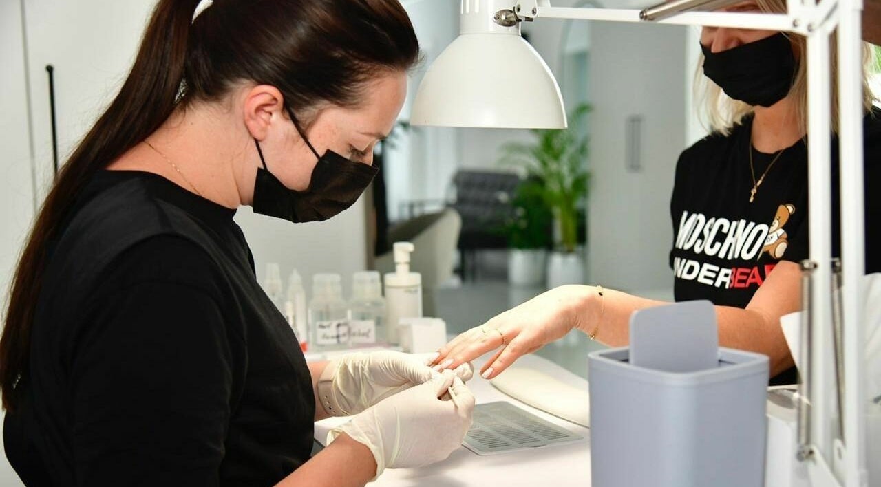 Nail technician providing expert manicure at Phenomenal Ladies Salon, Abu Dhabi, AE.