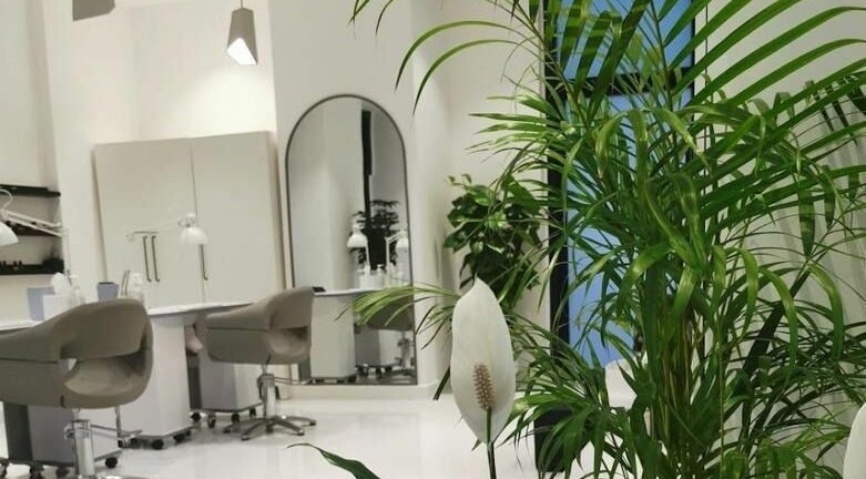 Peaceful salon space at Phenomenal Ladies Salon in Abu Dhabi, AE featuring lush greenery and elegant decor.