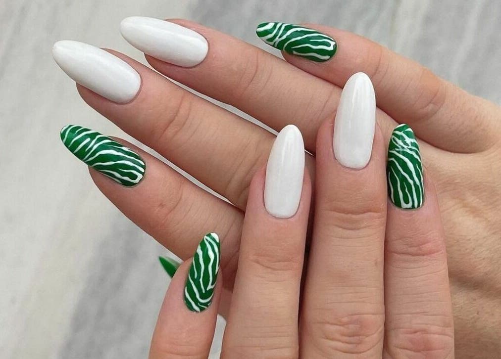 Elegant green and white zebra nail art at Phenomenal Ladies Salon, Abu Dhabi, AE.