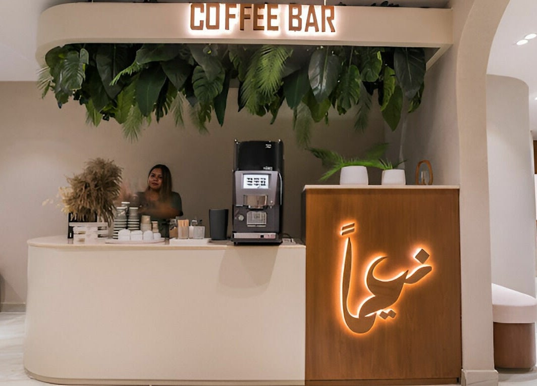 Chic coffee bar at Naeeman Garden Hotel, Jabriya, Hawalli Governorate, KW with modern design and lush decor.