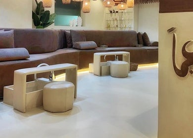 Elegant seating area at Naeeman Salon صالون نعيماً in Jabriya, Hawalli Governorate, KW with plush couches and modern decor.