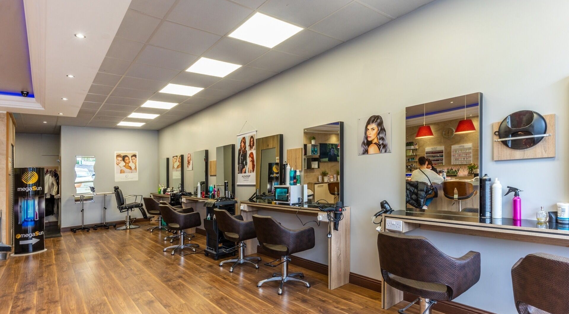Modern salon interior at Rainbow Hair & Beauty, Dublin, County Dublin, IE, featuring stylish chairs and mirrors.