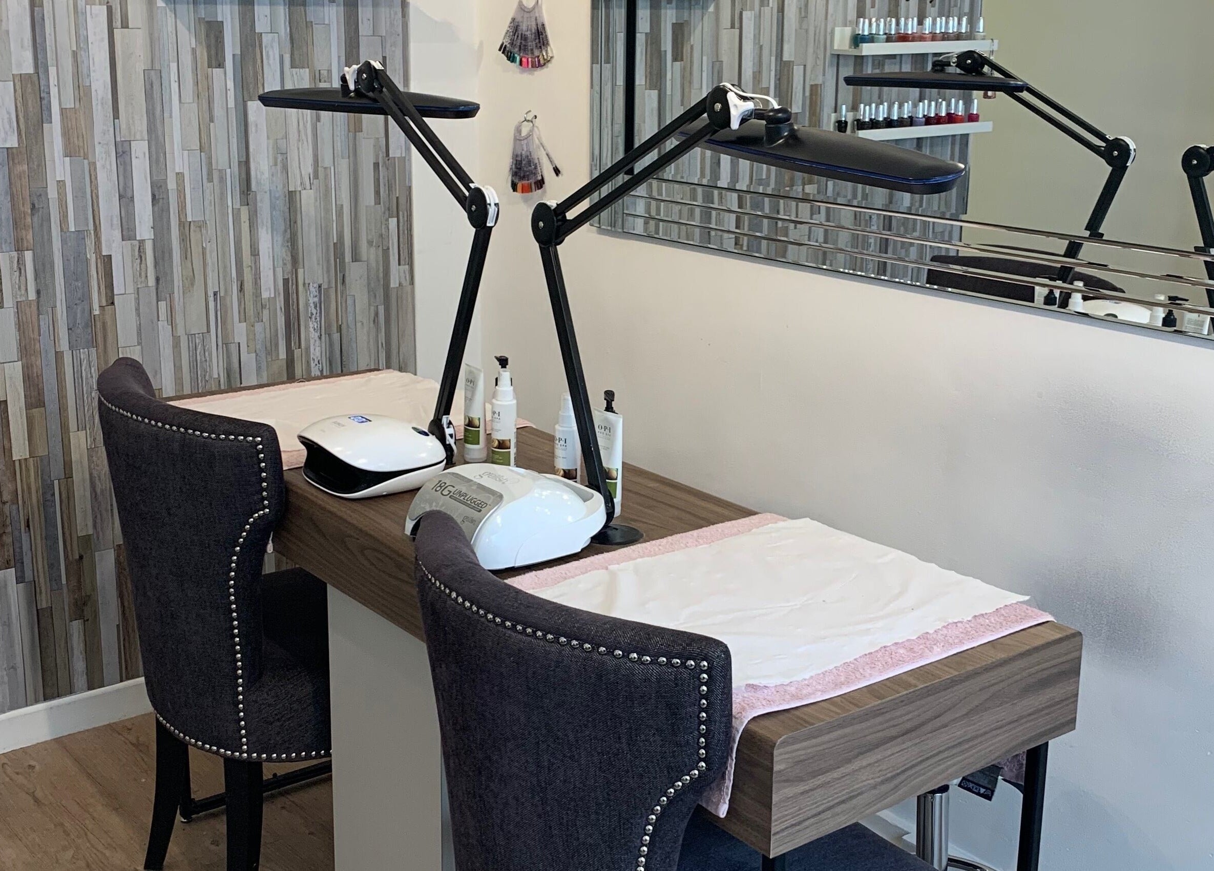 Nail station at Divine Health and Beauty, Manningtree, England, GB, showcasing modern decor and equipment.