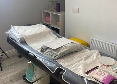 Relaxing treatment room at The Beauty House, THURSO, Scotland, GB, showcasing a comfy spa bed and equipment.