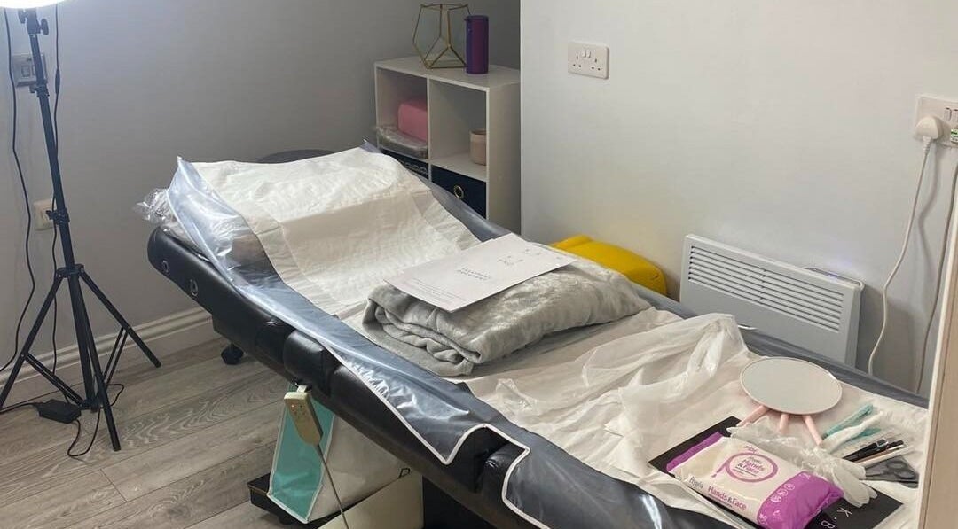 Relaxing treatment room at The Beauty House, THURSO, Scotland, GB, showcasing a comfy spa bed and equipment.