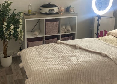 Relaxing treatment room at The Beauty House, THURSO, Scotland, GB with cozy decor and ambient lighting.