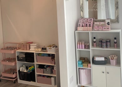 The Beauty House in Thurso, Scotland, GB, showcases elegant shelves stocked with cosmetics products.