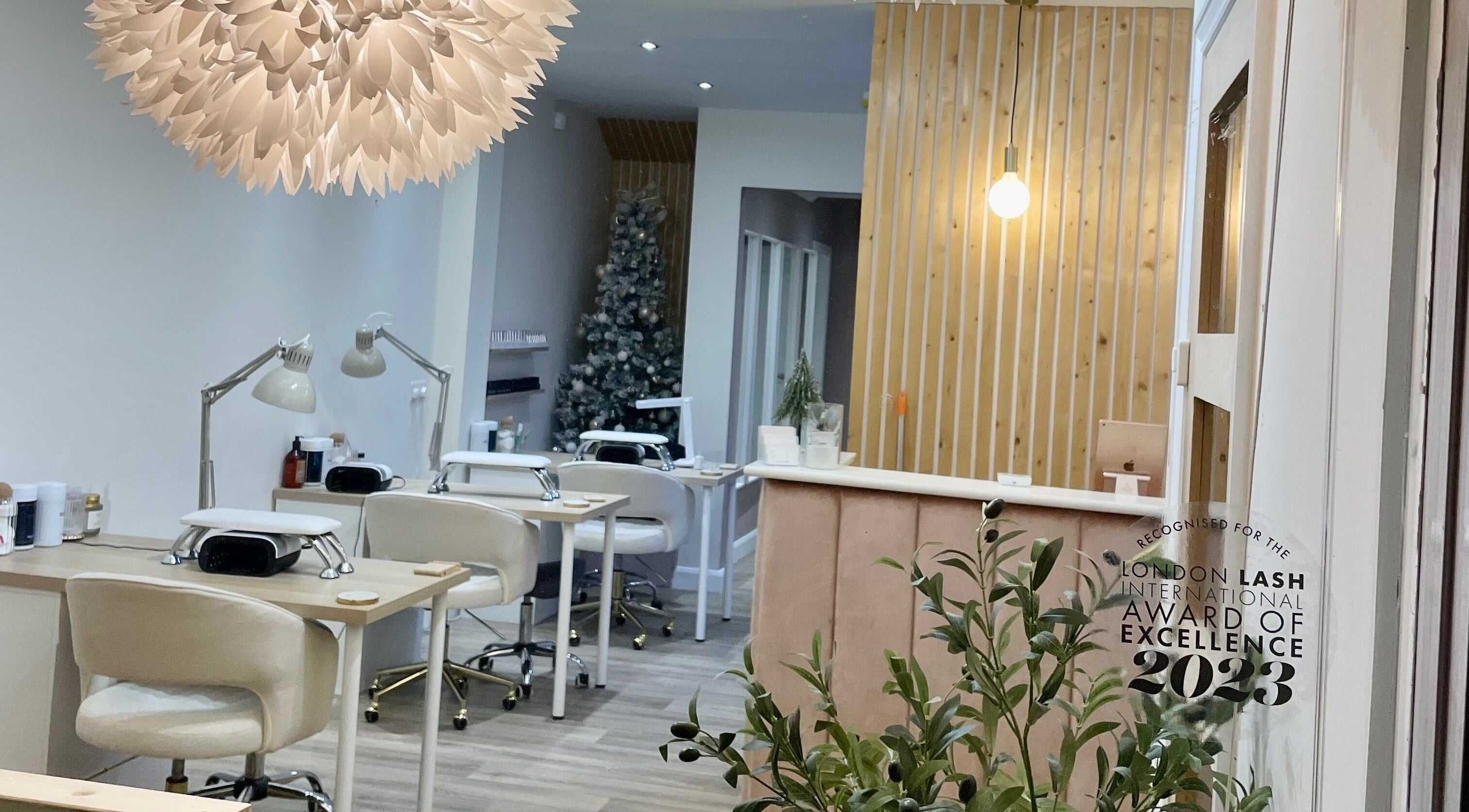 Elegant interior of Studio K Beauty in Malton, England, GB with modern decor and award display.