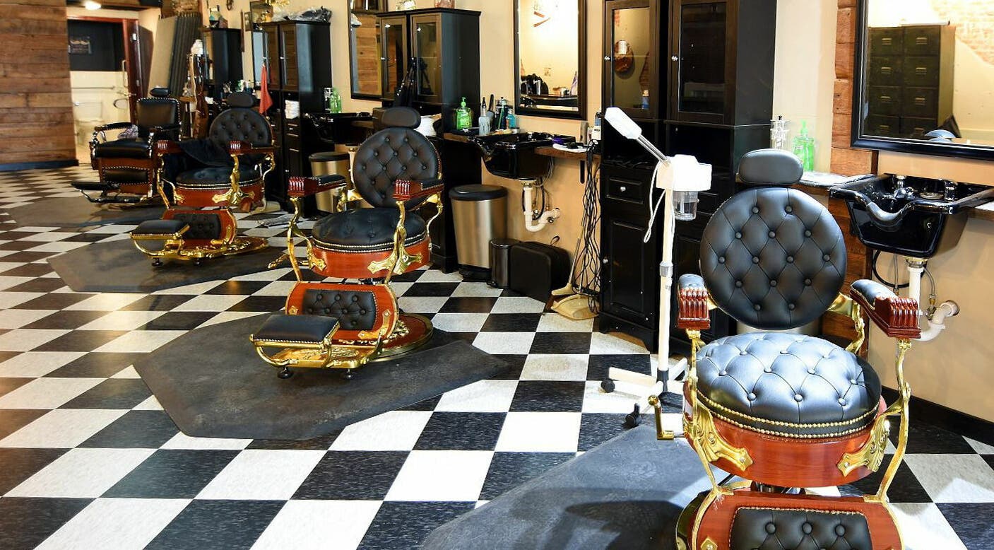Elegant barber chairs at Two-Bit Barber Company in Sedalia, Missouri, US showcasing classic grooming style.