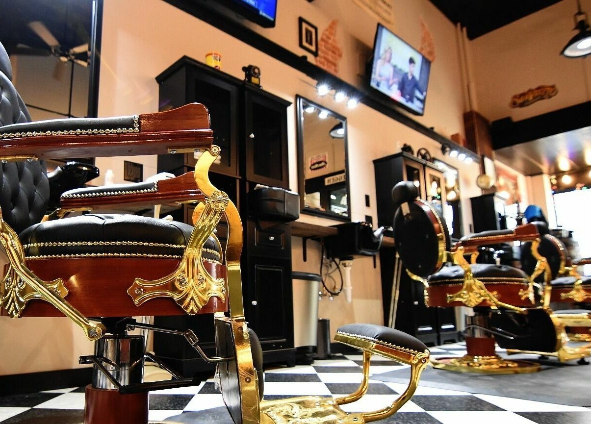 Elegant vintage barber chairs at Two-Bit Barber Company in Sedalia, Missouri, US, featuring classic decor.