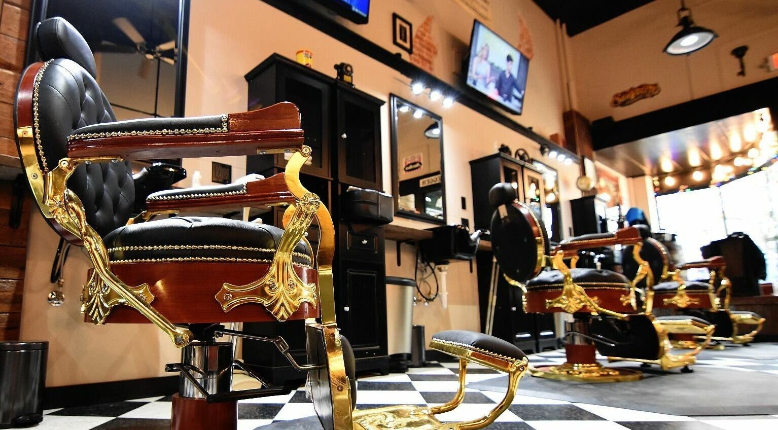 Elegant vintage barber chairs at Two-Bit Barber Company in Sedalia, Missouri, US, featuring classic decor.