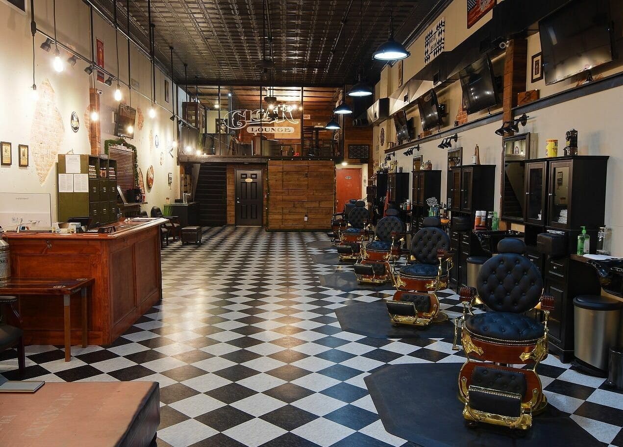 Chic interior of Two-Bit Barber Company in Sedalia, Missouri, US showcasing vintage barber chairs and classic decor.