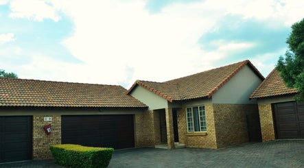 Front view of Babochka Hair and Makeup Artistry in Pretoria, Gauteng, ZA, showcasing its elegant brick facade.