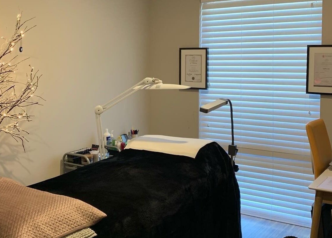 Cozy treatment room at Blinq Lashes, Stirling, Western Australia, AU with a massage table and ambient lighting.