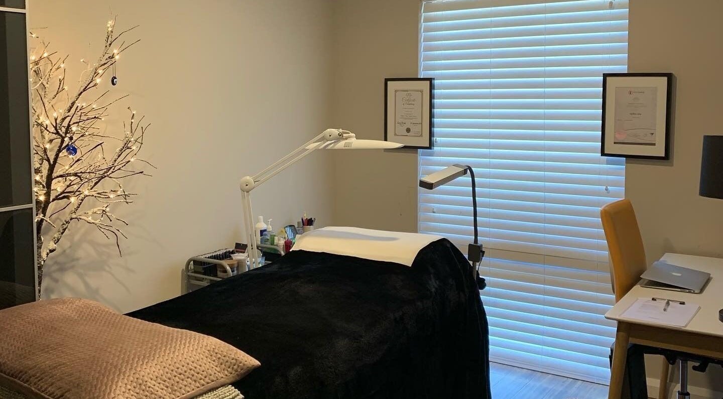 Cozy treatment room at Blinq Lashes, Stirling, Western Australia, AU with a massage table and ambient lighting.