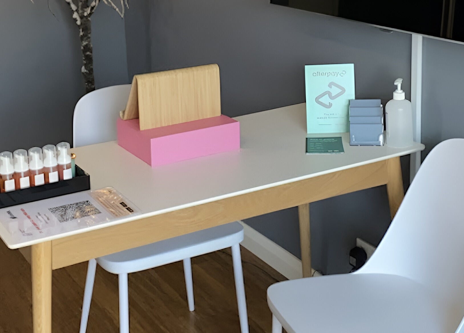 Modern reception area at Blinq Lashes, Stirling, Western Australia, AU, with sleek table setup and soothing ambiance.