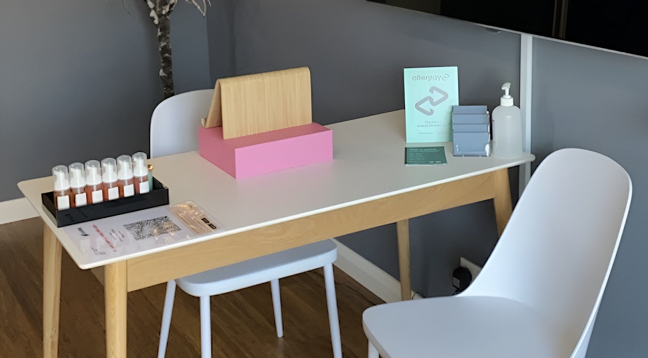 Modern reception area at Blinq Lashes, Stirling, Western Australia, AU, with sleek table setup and soothing ambiance.