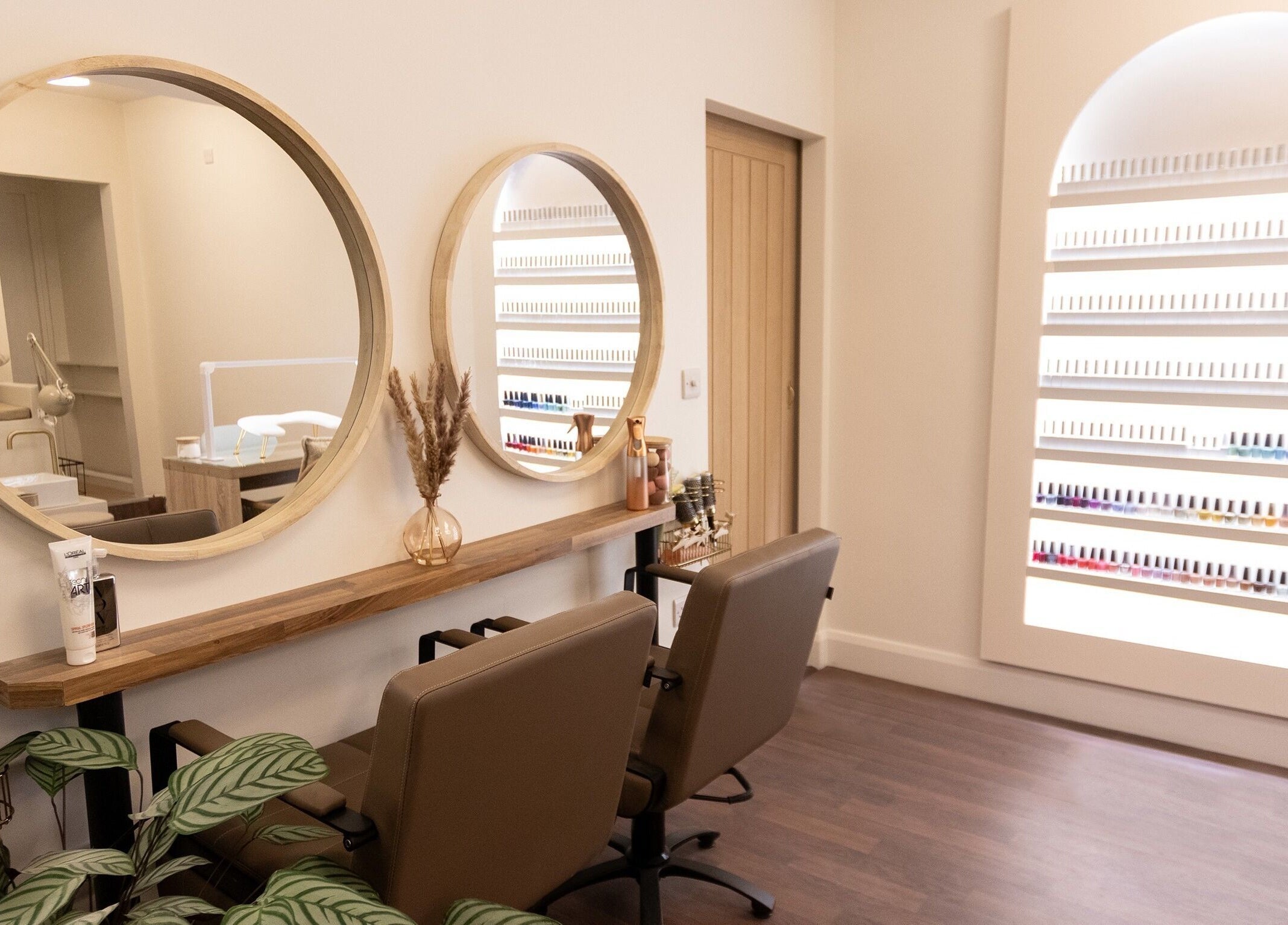 Elegant salon interior at Classic Beauty Boutique, Bournemouth, England, GB, featuring stylish mirrors and seating.