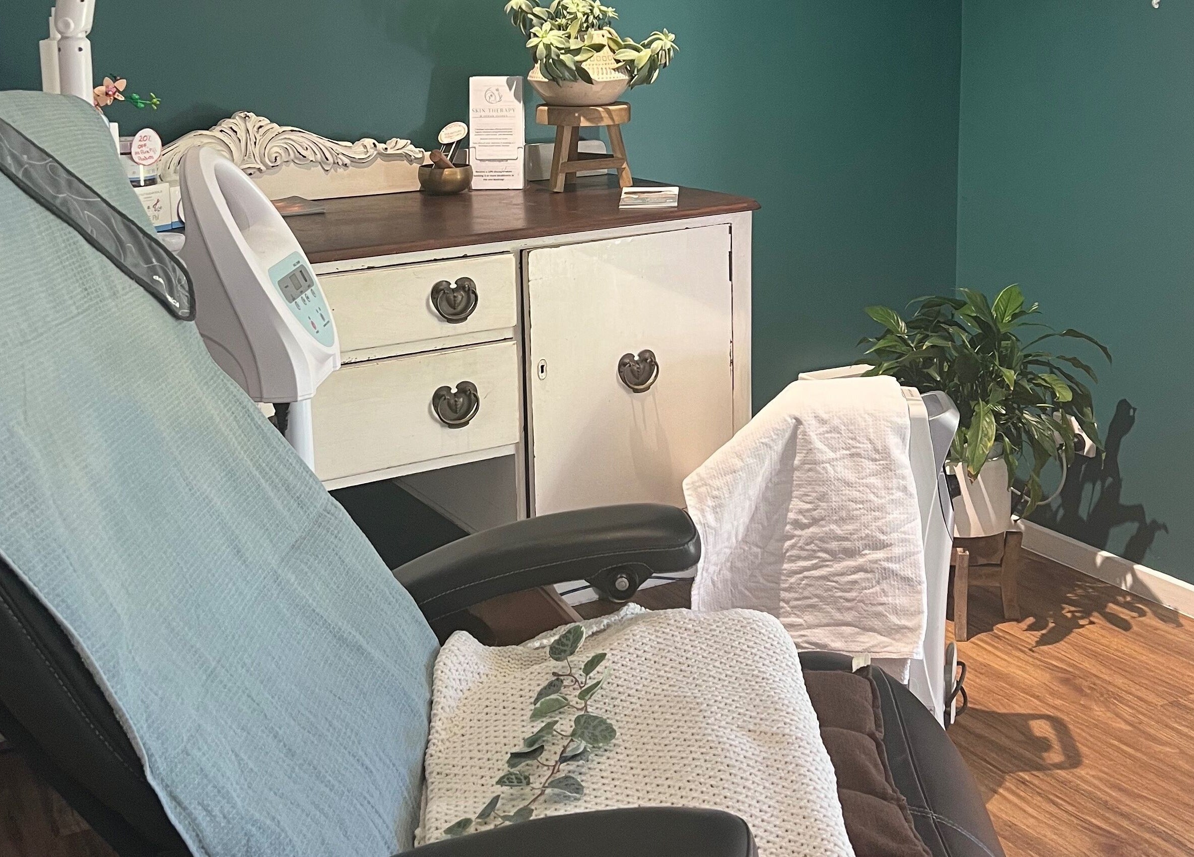 Relaxing treatment room at Skin Therapy at Ocean Shores, New South Wales, AU with cozy chair and calming decor.
