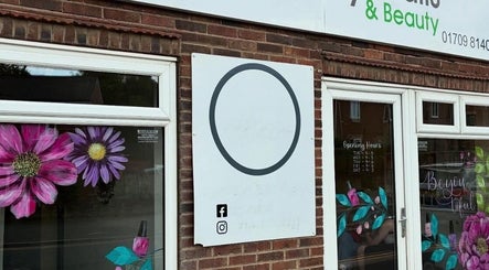 Exterior of Truly Madly Nails & Beauty in Maltby, England, GB featuring floral window art and signage.