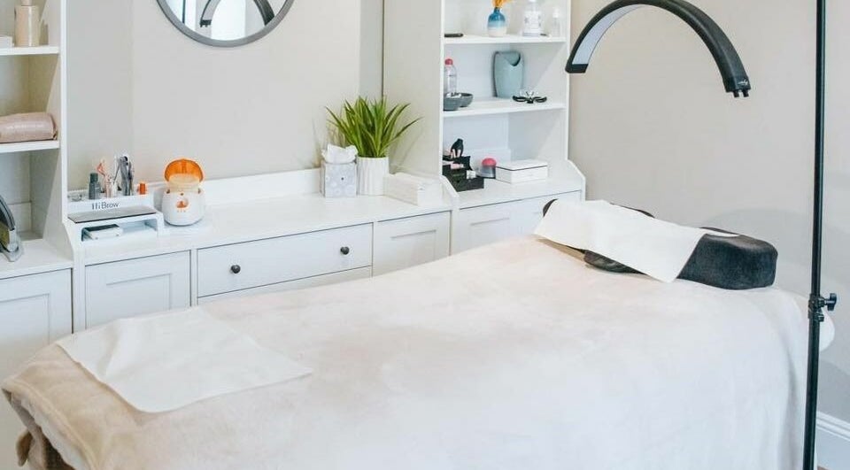 Elegant spa room at Cornish Beauty Rooms, Saint Ives, England, GB with massage table and beauty products.