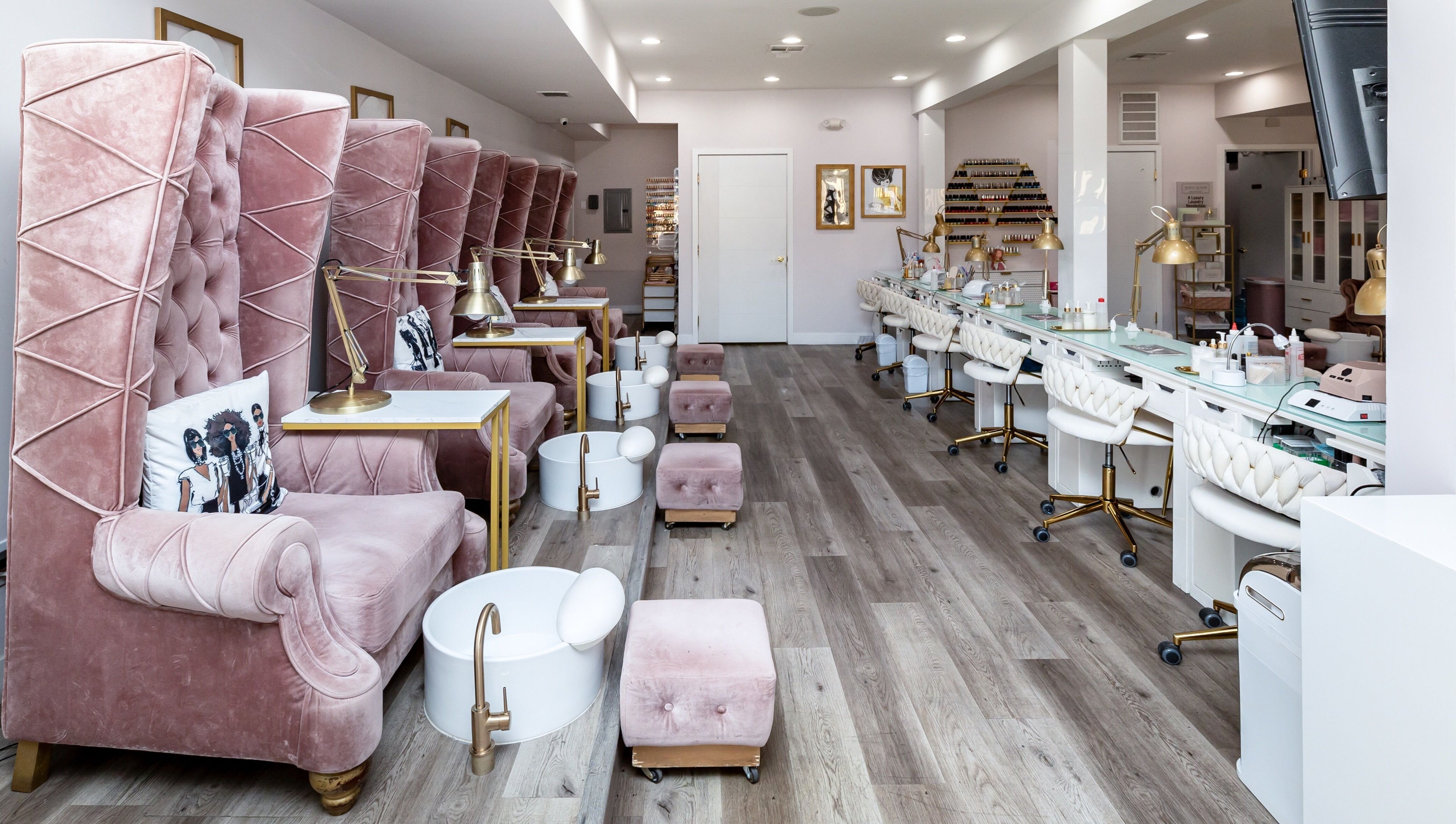 Luxurious interior of Queen B Nail Salon in Glendale, California, US with plush pink seating and modern decor.