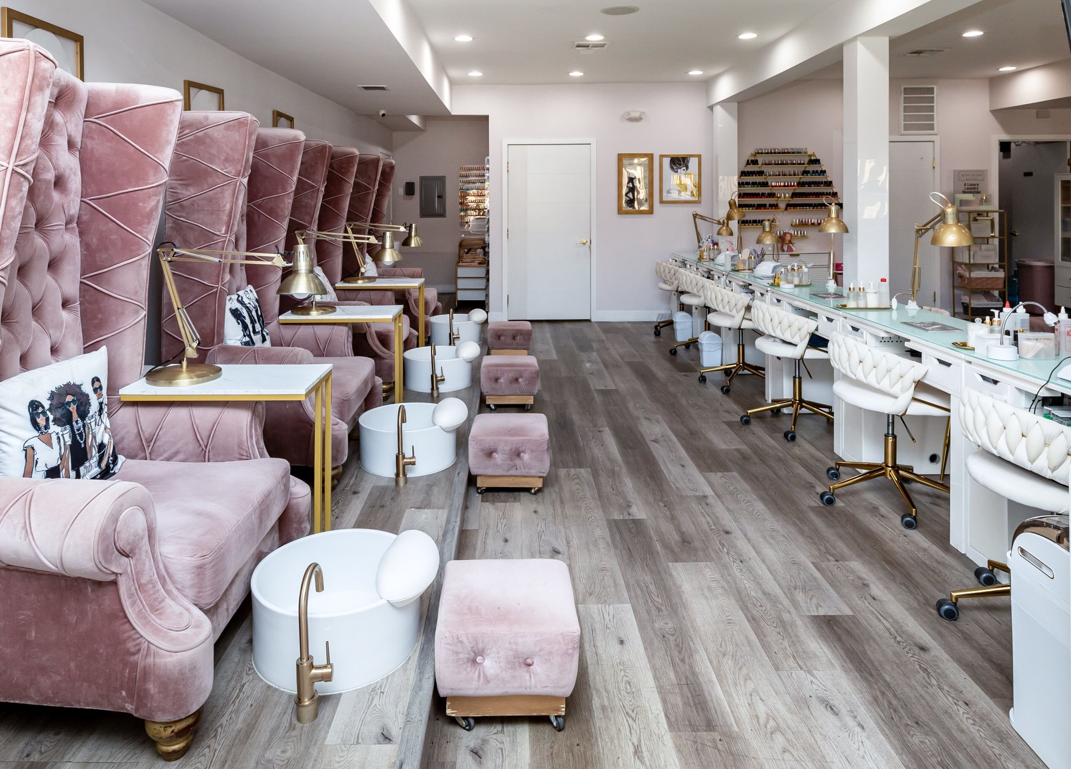 Luxurious interior of Queen B Nail Salon in Glendale, California, US with plush pink seating and modern decor.