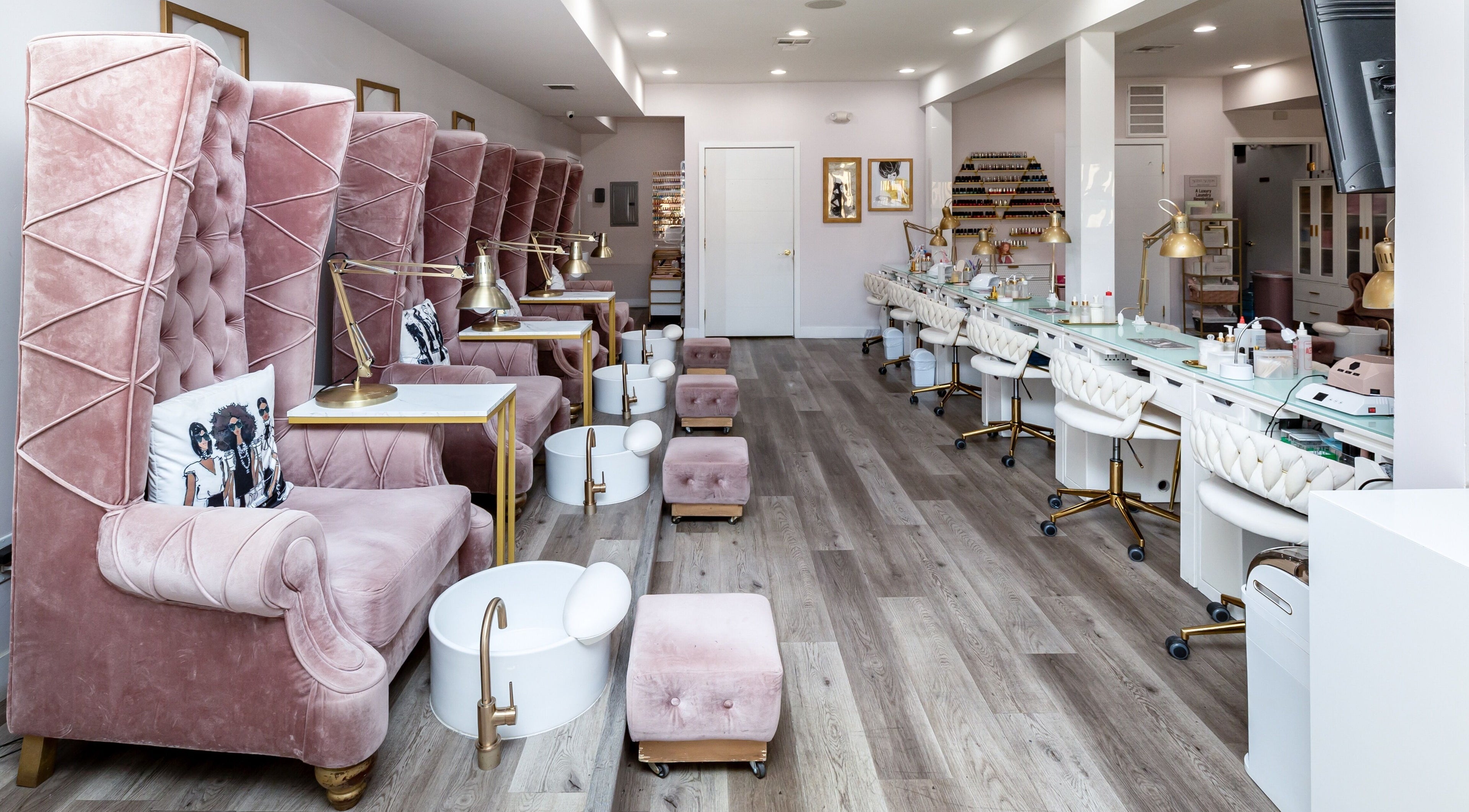 Luxurious interior of Queen B Nail Salon in Glendale, California, US with plush pink seating and modern decor.