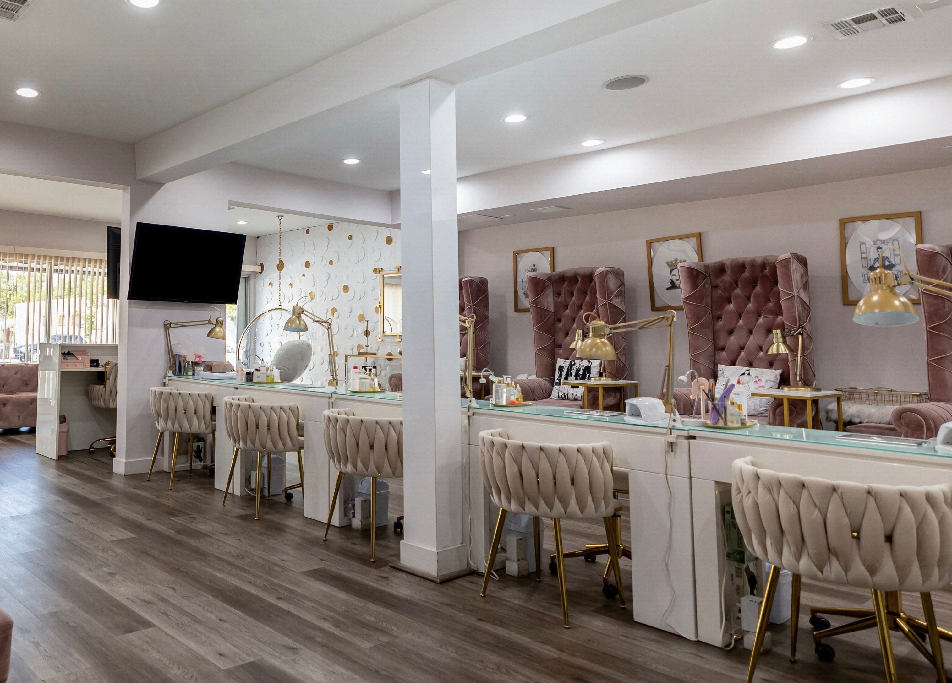 Elegant interior of Queen B Nail Salon, Glendale, California, showcasing plush seating and modern amenities.