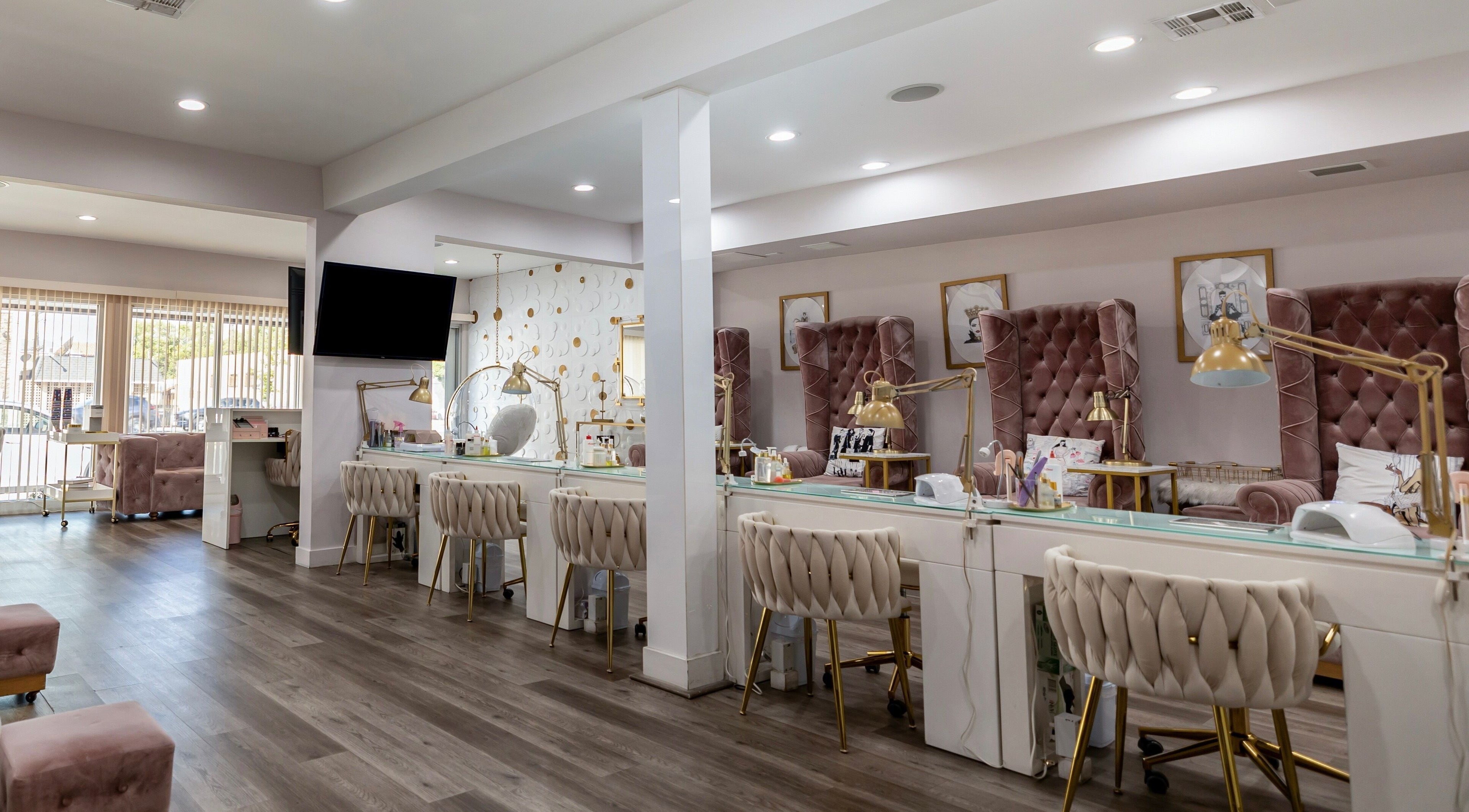 Elegant interior of Queen B Nail Salon, Glendale, California, showcasing plush seating and modern amenities.
