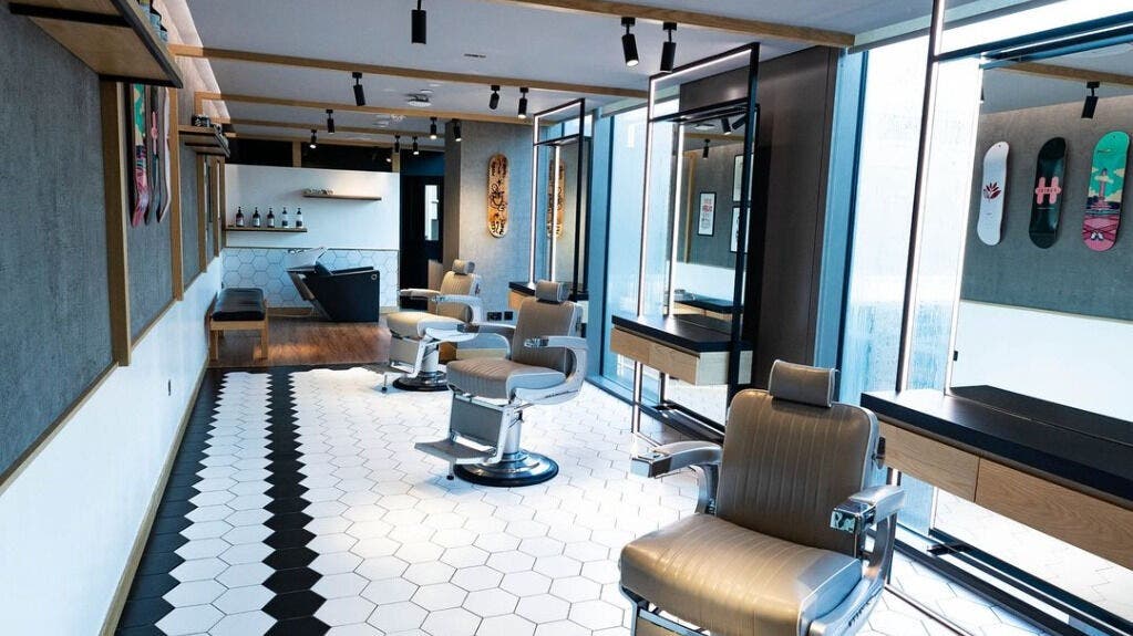 Modern interior of Akin Barber and Shop at 25 Hours Hotel, Dubai, Dubai, AE, showcasing stylish barber chairs.