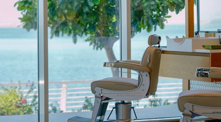 Barber chair overlooking sea at Akin Barber & Shop AbuDhabi By The Creek, Abu Dhabi, AE. Relaxing view.