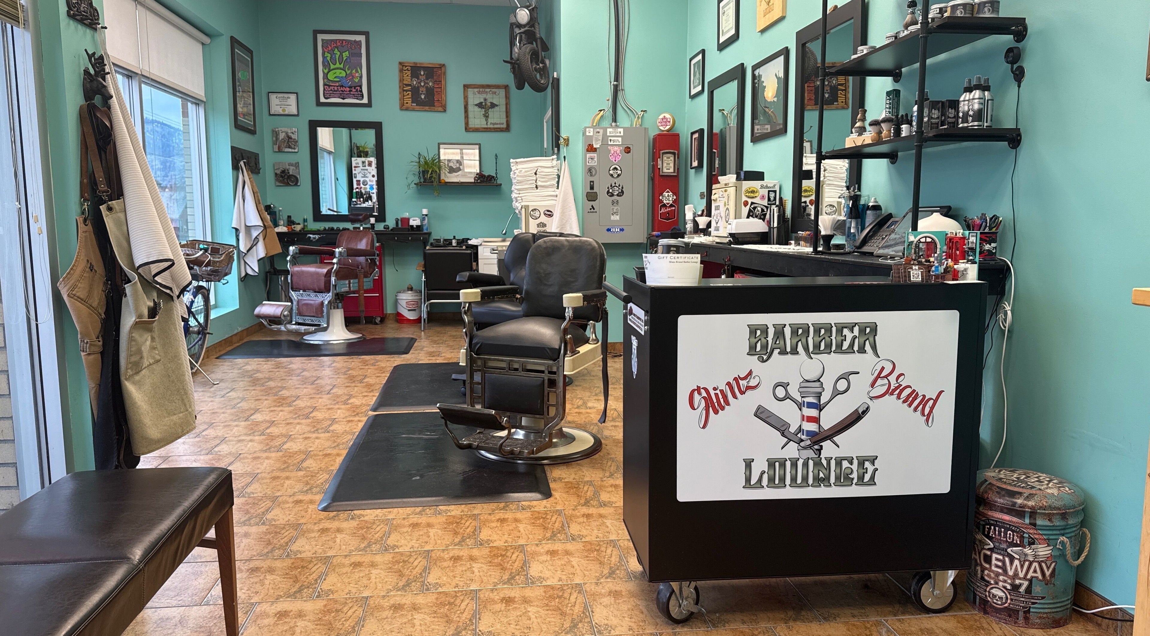 Interior of Slimz Brand Barber Lounge in Penticton, British Columbia, CA, showcasing vintage chairs and decor.