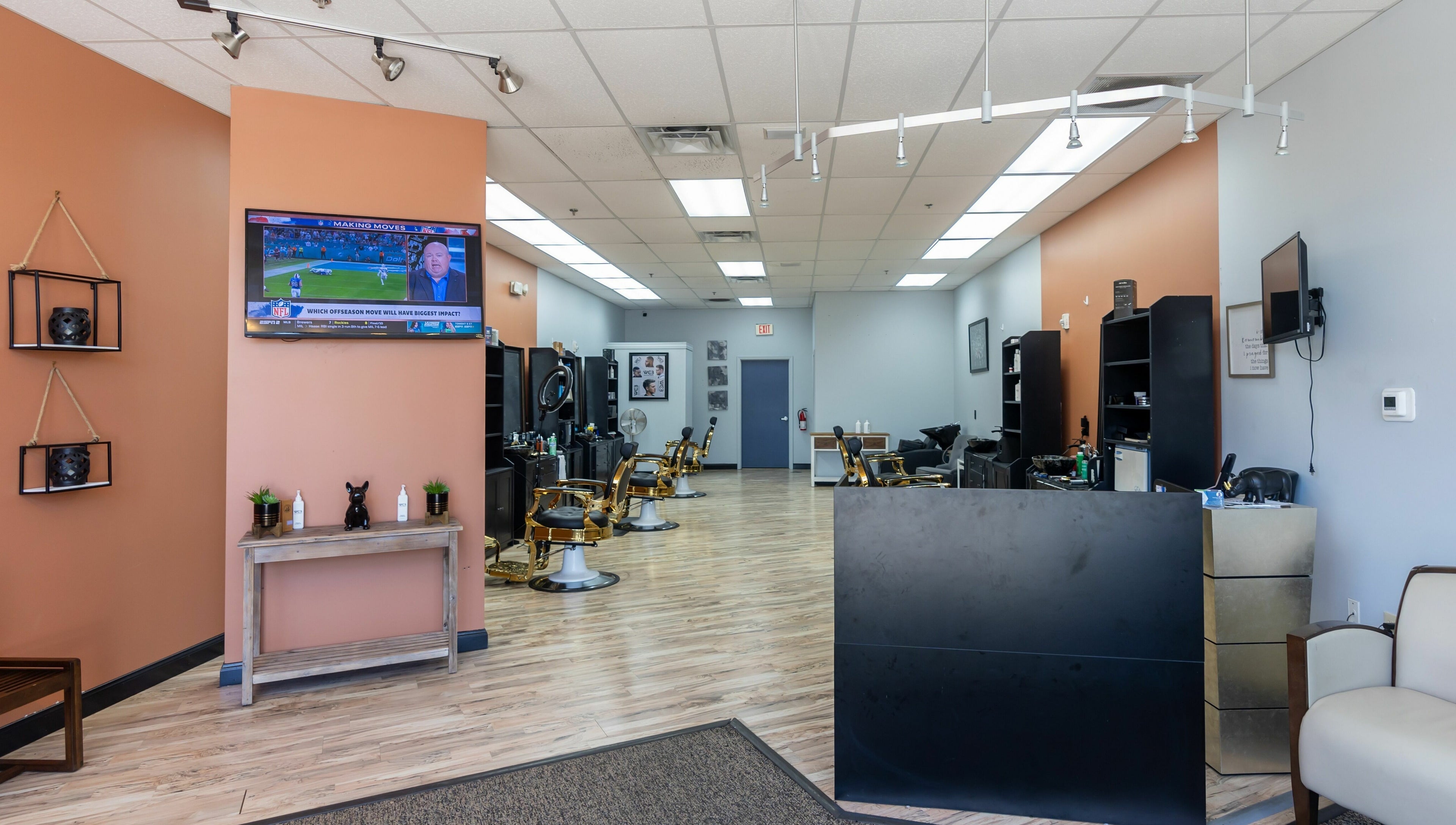Interior of World Class Barbers - Matthews, showing modern decor and barber chairs, Matthews, North Carolina, US.