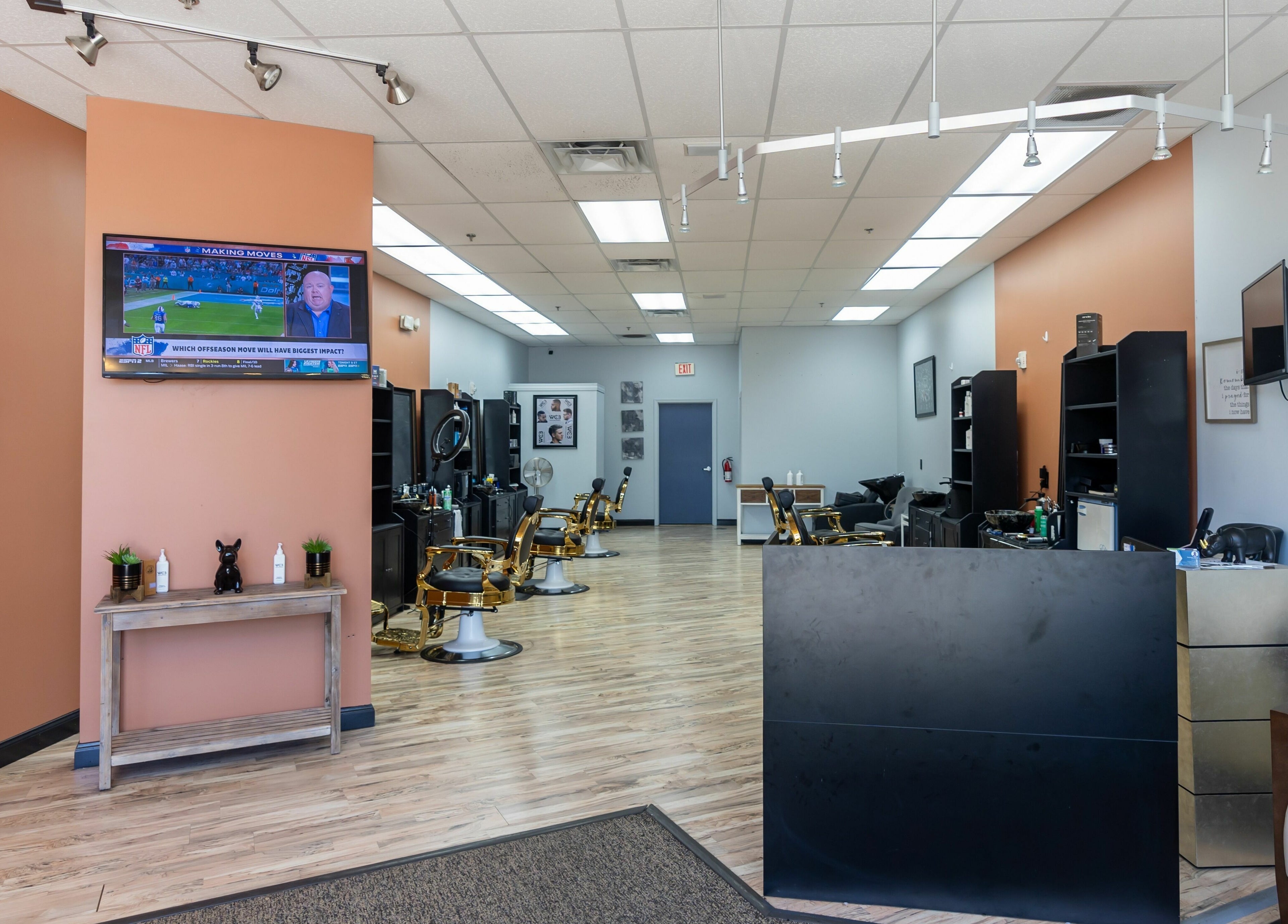 Interior of World Class Barbers - Matthews, showing modern decor and barber chairs, Matthews, North Carolina, US.