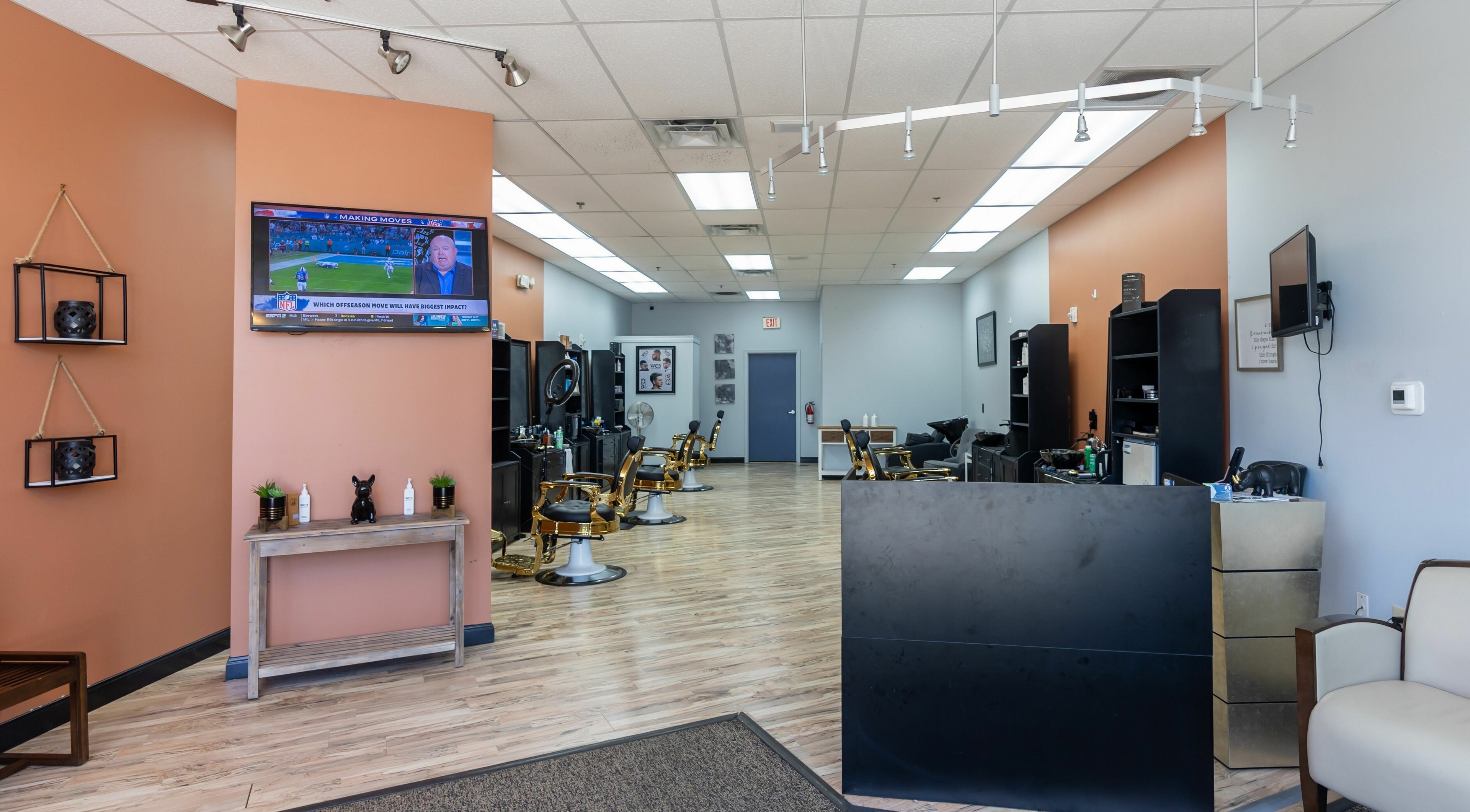 Interior of World Class Barbers - Matthews, showing modern decor and barber chairs, Matthews, North Carolina, US.