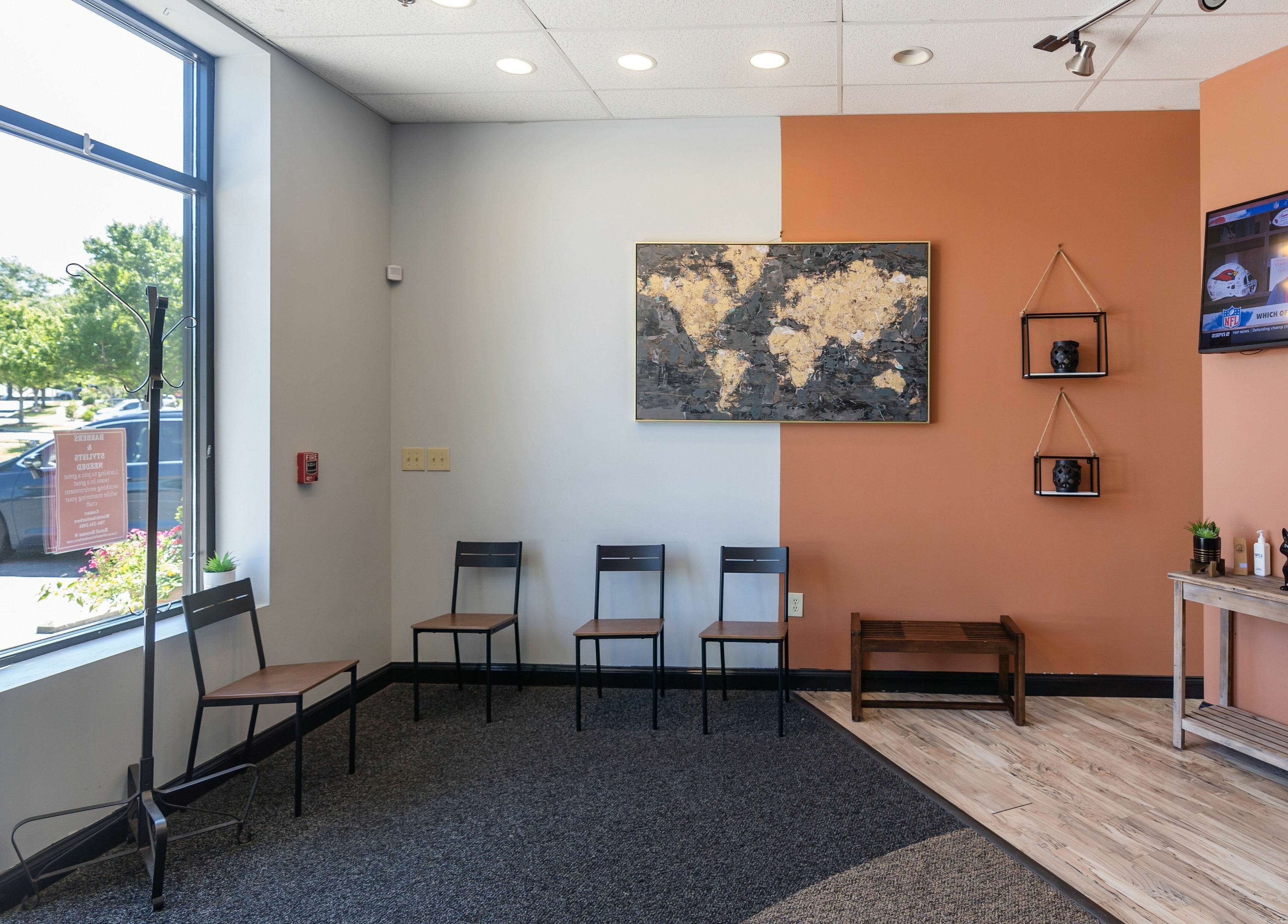 Cozy waiting area at World Class Barbers - Matthews, featuring modern decor in Matthews, North Carolina, US.