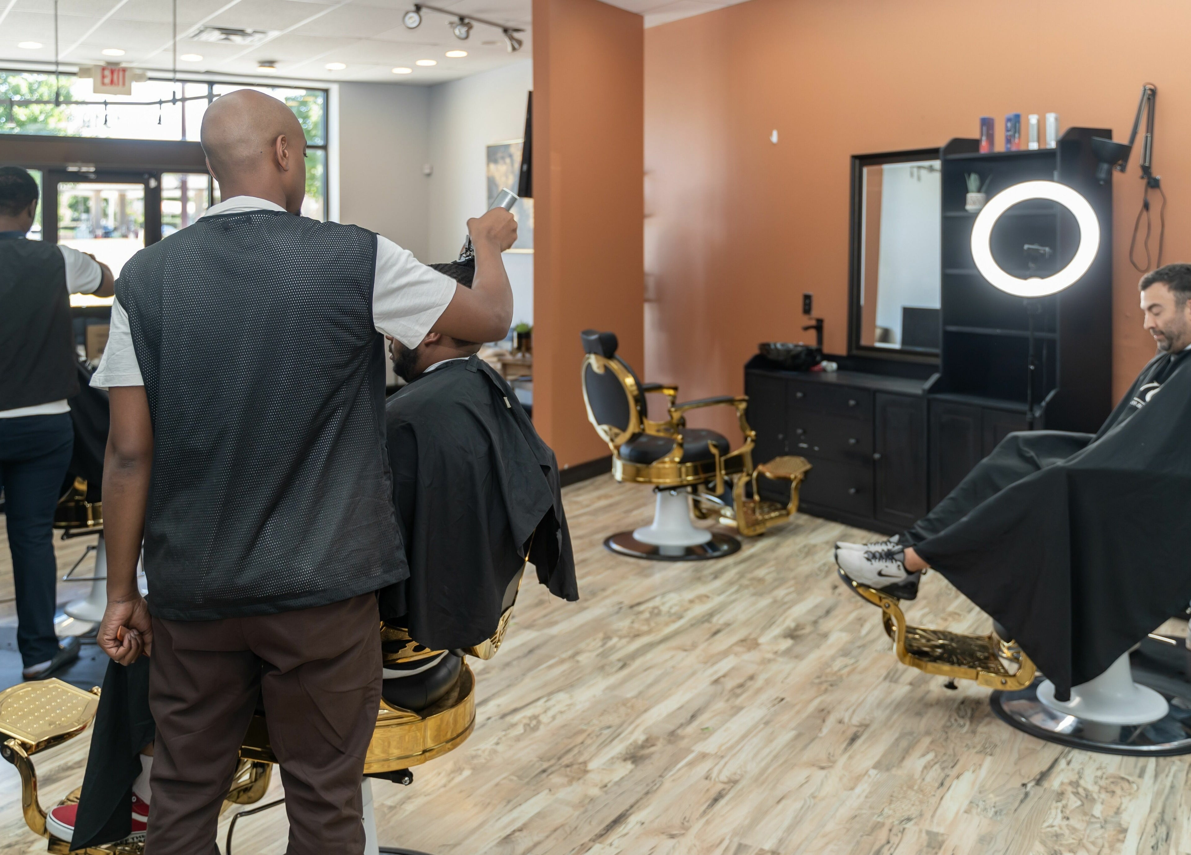 Stylish barbers at World Class Barbers - Matthews in Matthews, North Carolina, US, elegantly styling clients.