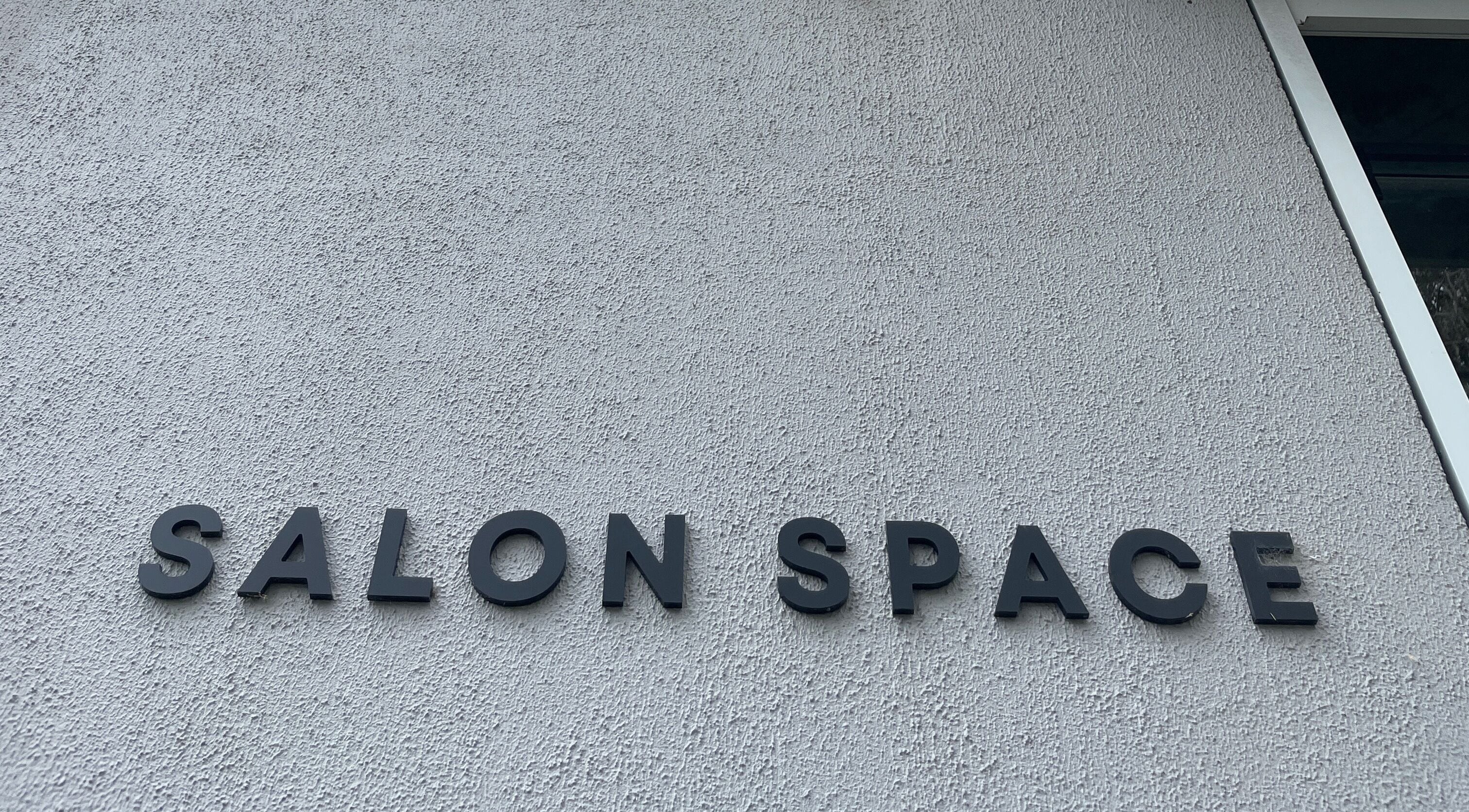 Exterior sign reading 'Salon Space' at Taylor (itsablondevibe), Melbourne, Victoria, AU.