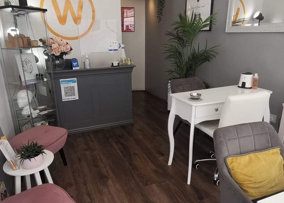 Stylish interior of The Wax Room in Paignton, England, GB with elegant chairs and decor.