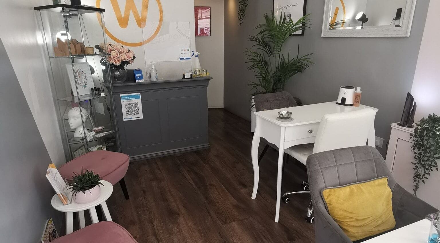 Stylish interior of The Wax Room in Paignton, England, GB with elegant chairs and decor.