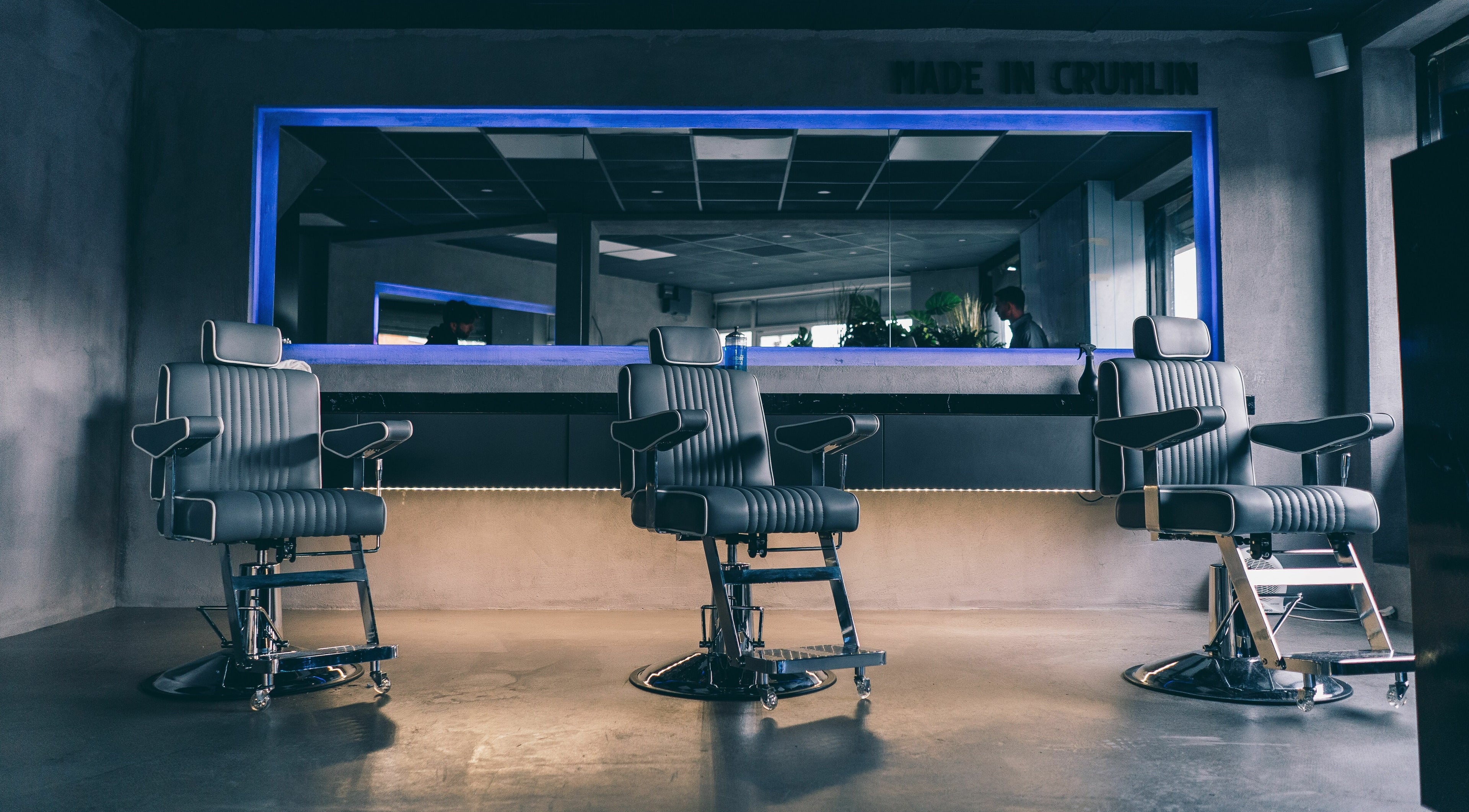 Stylish barber chairs at Old County Barbers Crumlin, Dublin, County Dublin, IE, with modern interior design.
