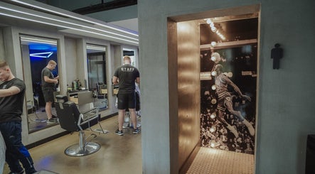 Stylish barbershop at Old County Clondalkin, Dublin, County Dublin, IE, with contemporary decor and mirrors.