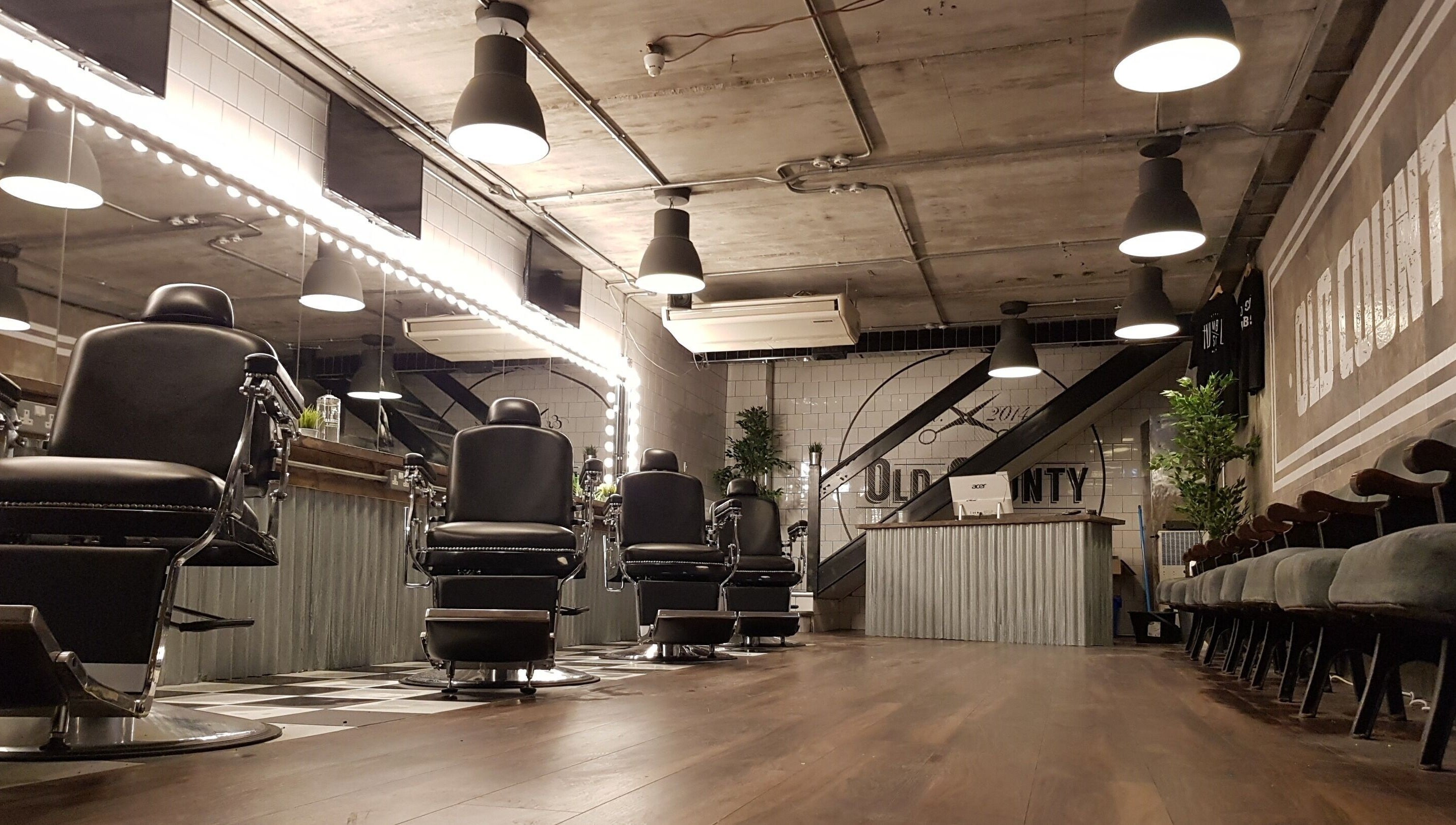 Modern barber chairs inside Old County Newbridge, Newbridge, County Kildare, IE, cozy and stylish interior.