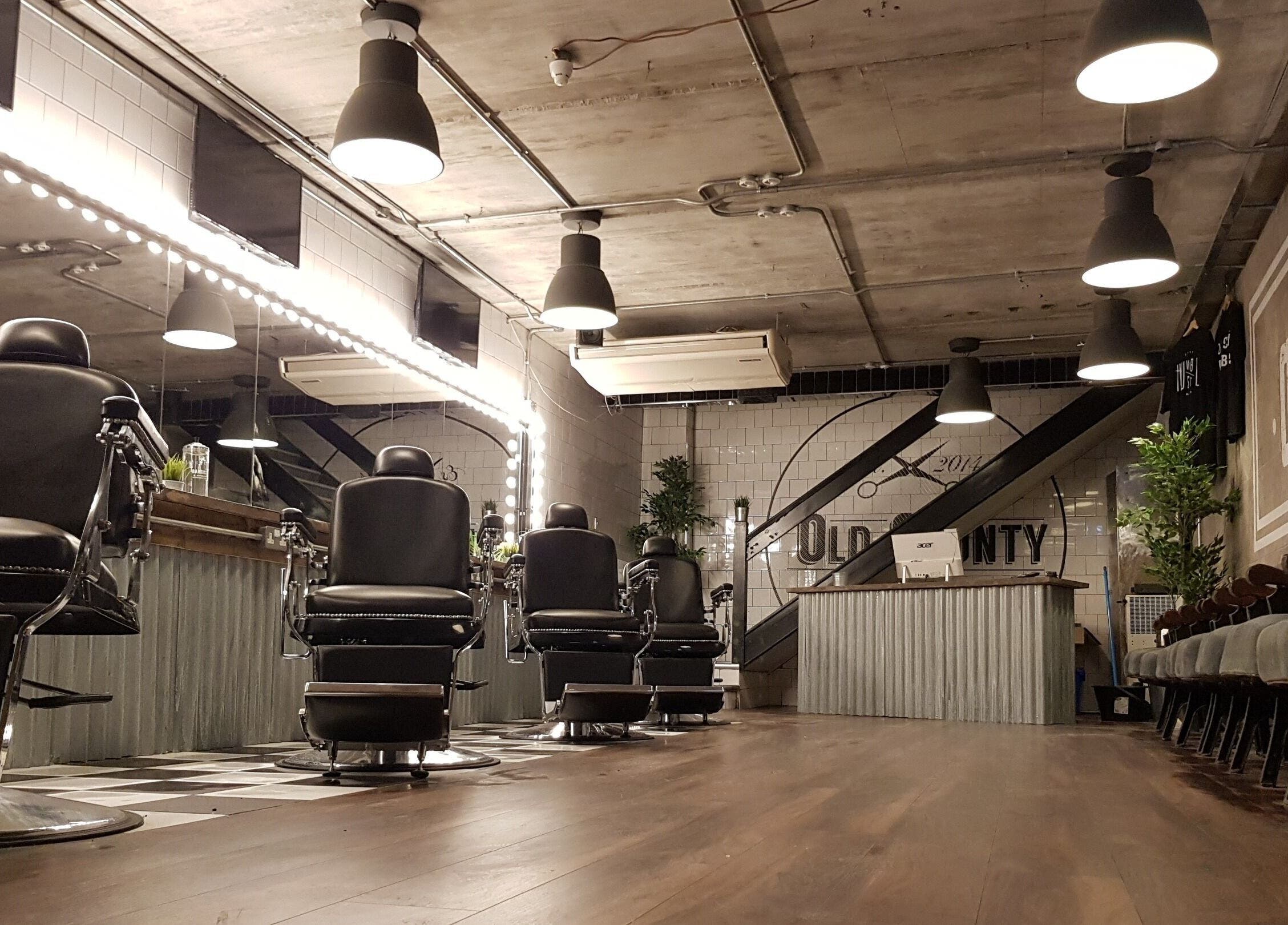 Modern barber chairs inside Old County Newbridge, Newbridge, County Kildare, IE, cozy and stylish interior.