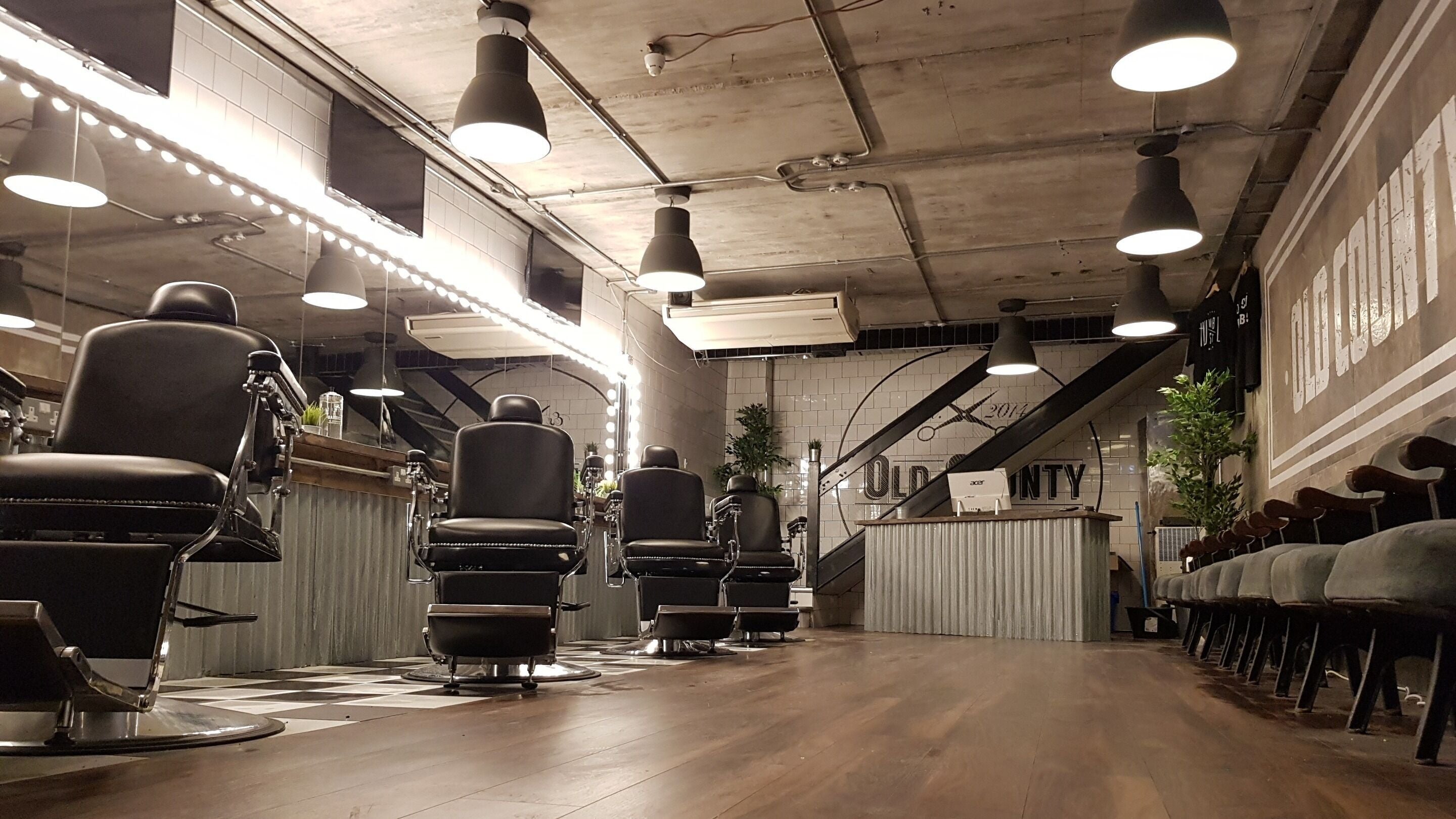 Modern barber chairs inside Old County Newbridge, Newbridge, County Kildare, IE, cozy and stylish interior.