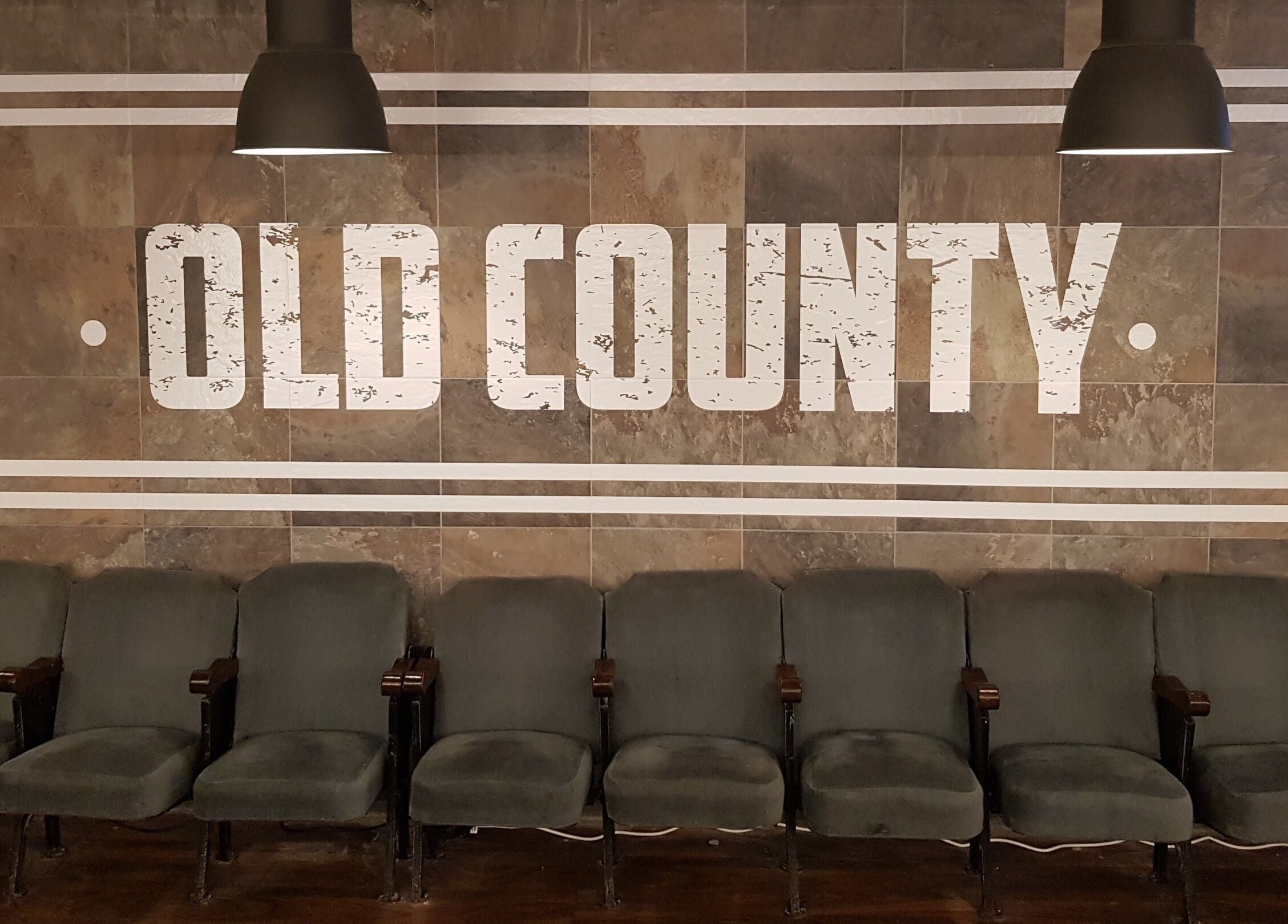 Comfortable seating at Old County Newbridge, Newbridge, County Kildare, IE, showcasing rustic ambiance.