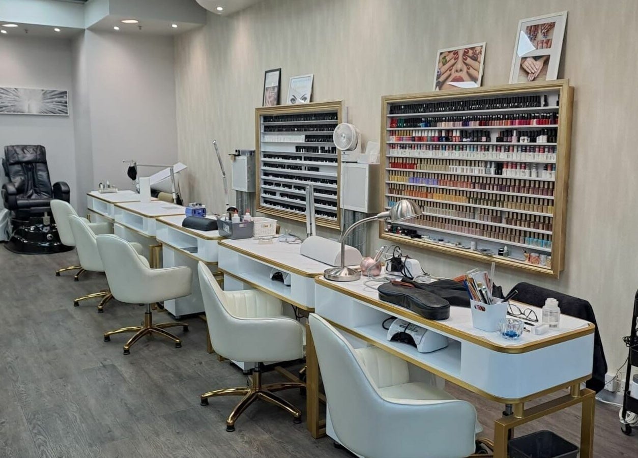 Elegant nail salon at Cover Beauty - Metrocentre, Metrocentre, England, GB with luxurious seating and polish selection.