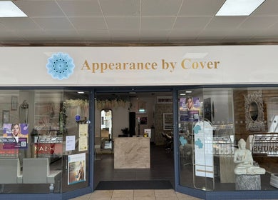 Entrance of Cover Beauty - Appearance, Newcastle, England, GB with stylish decor and signage.